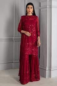 "Red Gharara: The Timeless Bridal Favorite"



